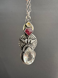 Rutilated quartz bird medallion
