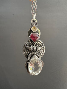 Rutilated quartz bird medallion