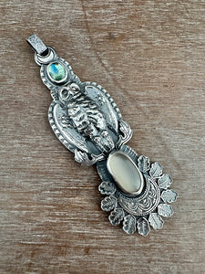 Helen the owl and a moonstone