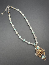 Load image into Gallery viewer, Bronze lion with aquamarine
