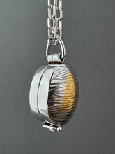 Load image into Gallery viewer, Textured oval flower locket.
