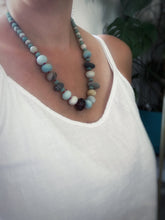 Load image into Gallery viewer, Beachy Bead collection hand knotted on red silk.
