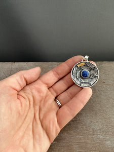 Silver fish parable pendant with lapis
