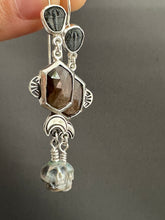 Load image into Gallery viewer, Trilobite, Bronze sapphire, and Carved Pearl Skull Dangle Earrings
