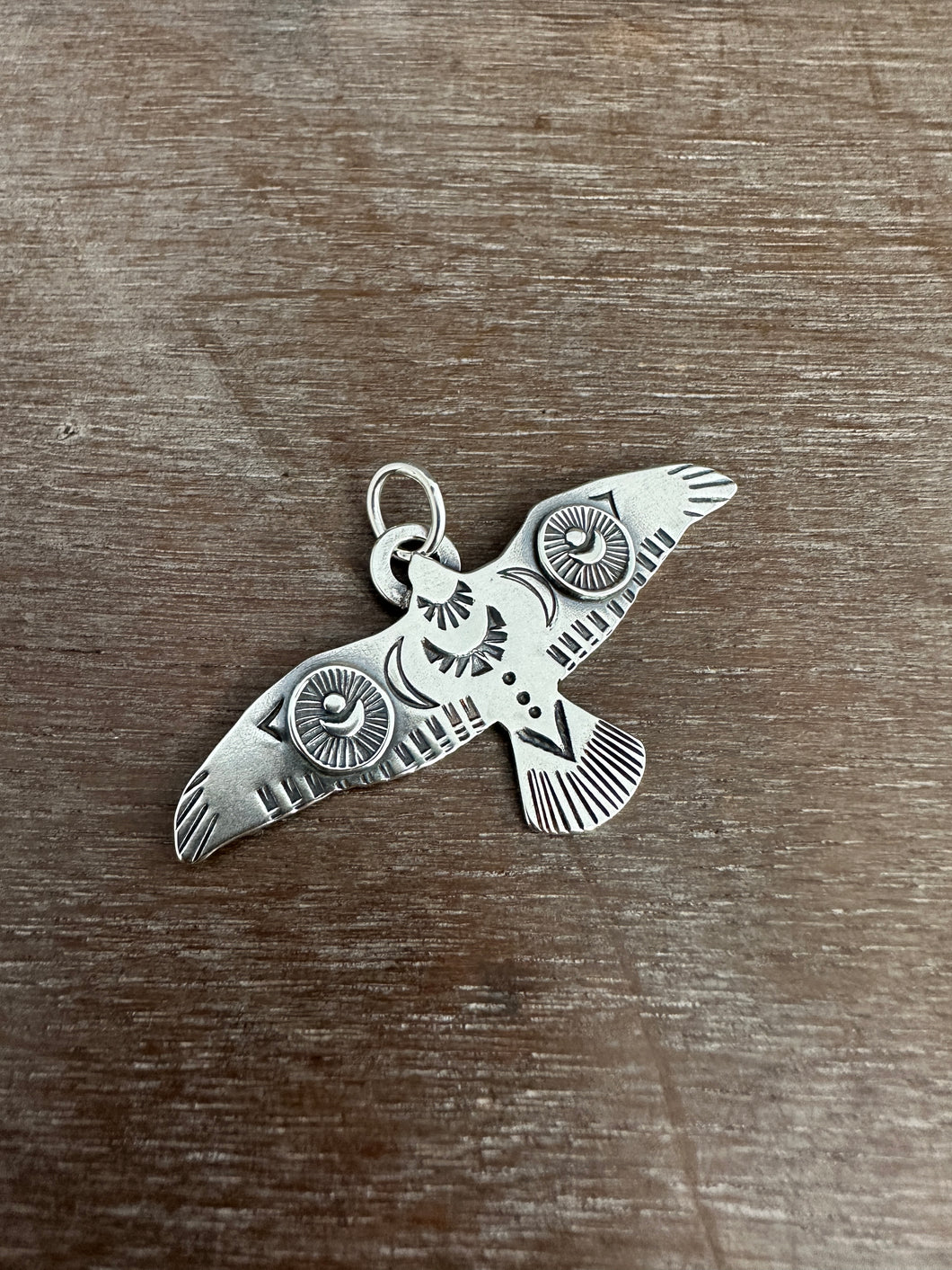 Large stamped bird pendant