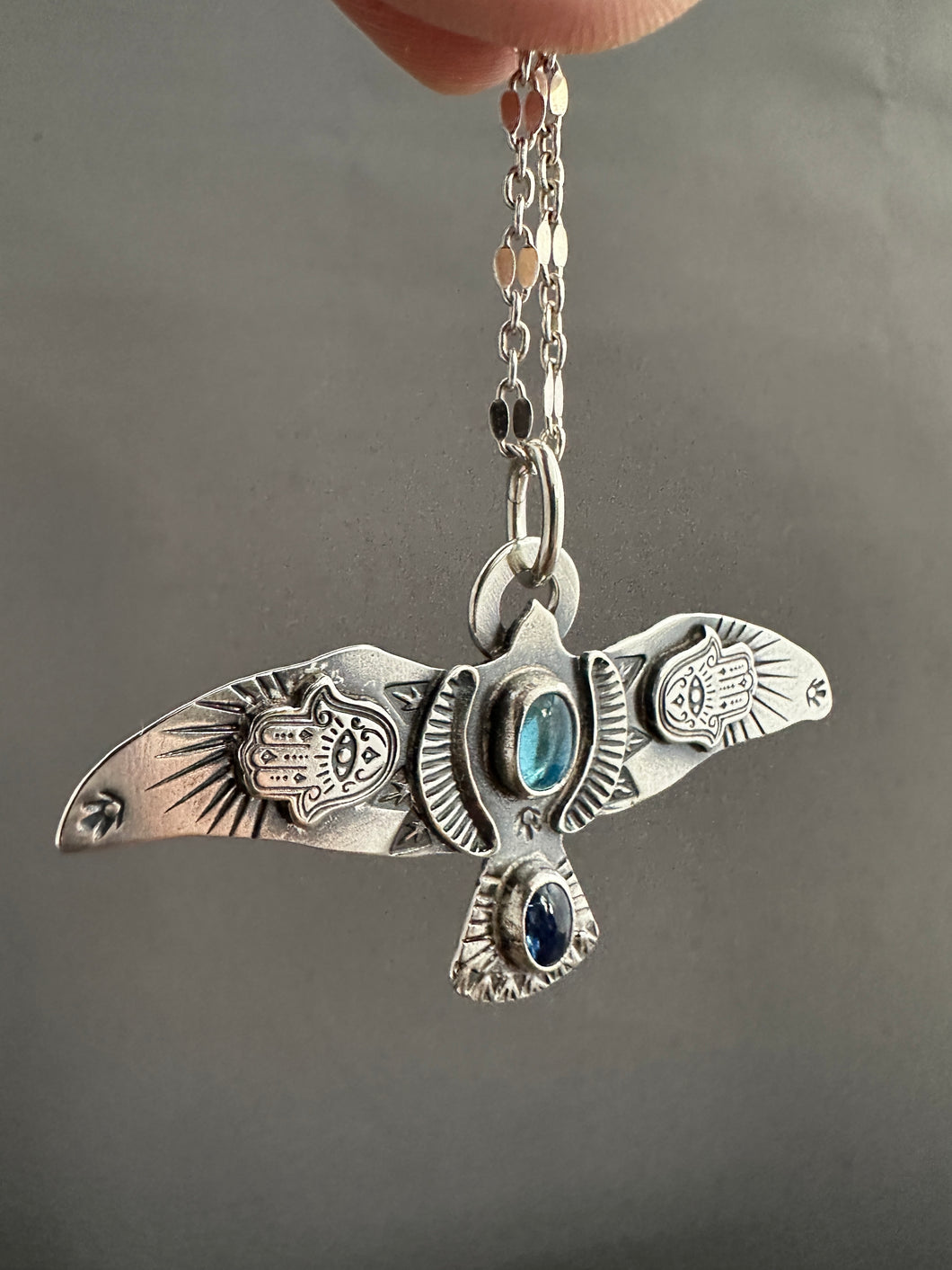 Large Blue Topaz and Kyanite stamped bird pendant