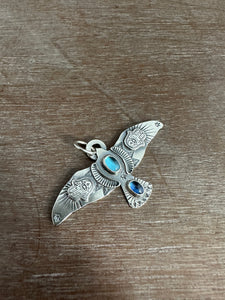 Large Blue Topaz and Kyanite stamped bird pendant
