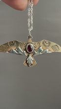 Load and play video in Gallery viewer, Bronze and silver stamped bird pendant with garnet

