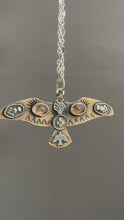 Load and play video in Gallery viewer, Bronze and silver stamped bird pendant with pink tourmaline
