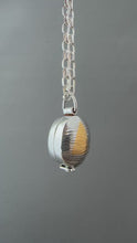 Load and play video in Gallery viewer, Textured oval flower locket.
