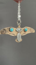Load and play video in Gallery viewer, Bronze and silver stamped bird pendant with turquoise
