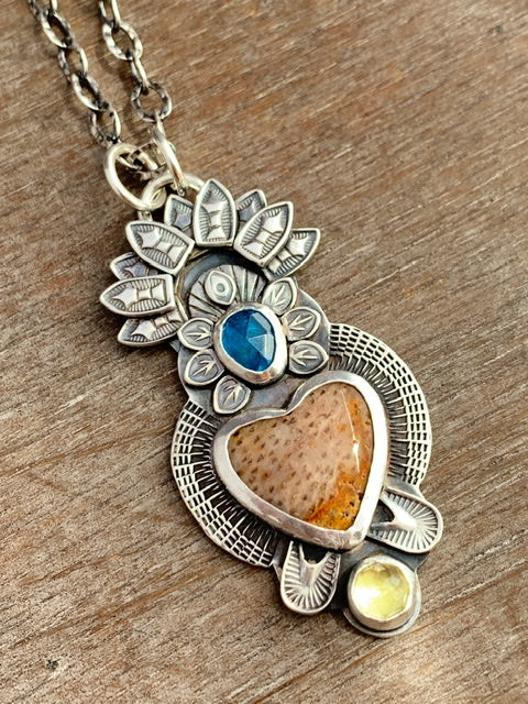 Fossilized coral sacred heart pendant