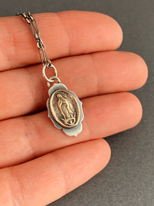 Our Lady of Guadeloupe bronze and silver single charm