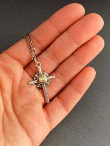 Small moissanite and gold cross