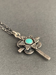 Small turquoise cross