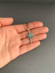 Small turquoise cross