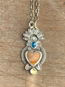 Fossilized coral sacred heart pendant