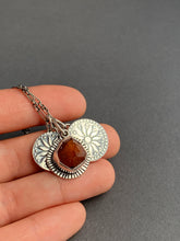 Load image into Gallery viewer, Raw garnet crystal with two “coin” charms
