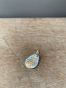 Silver and gold scale pattern charm