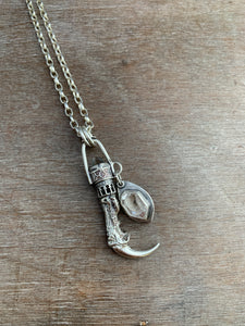 Cast owl talon and crystal pendant