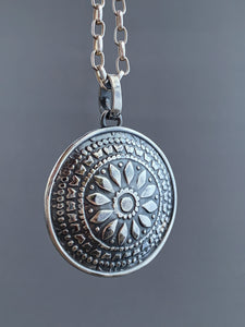 Included quartz double sided medallion