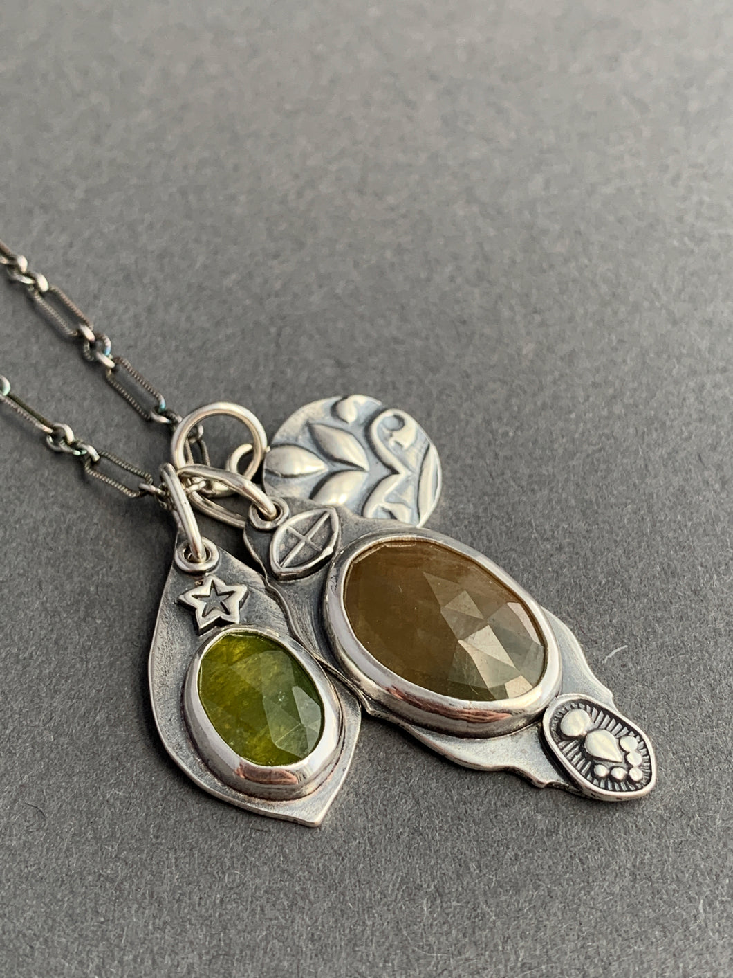 Sapphire and vesuvianite charms with a leaf “coin” accent charm