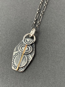 Sterling silver and 18k gold pendant