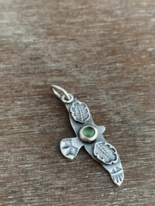 Small serpentine stamped bird pendant