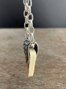 Fossilized woolly mammoth ivory charm