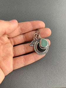 Lake Erie beach stone charm necklace, with a teal ceramic shard, and tiny fish charms