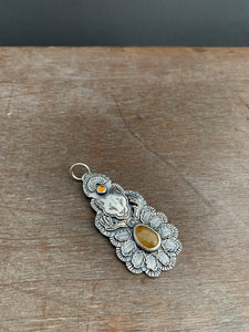 Mountain lion sapphire pendant