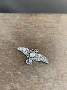 Large moonstone stamped bird pendant