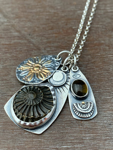 Ammonite fossil, and Tourmaline Charms
