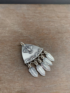 Sterling silver bird with dangly feathers pendant
