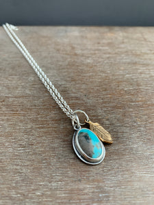 Small Turquoise charm with a 14k gold filled feather