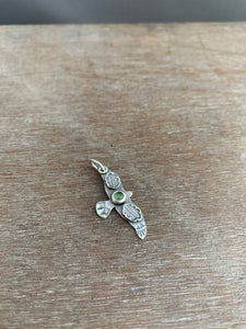 Small serpentine stamped bird pendant