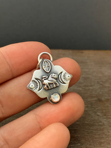 Small lion and moonstone pendant