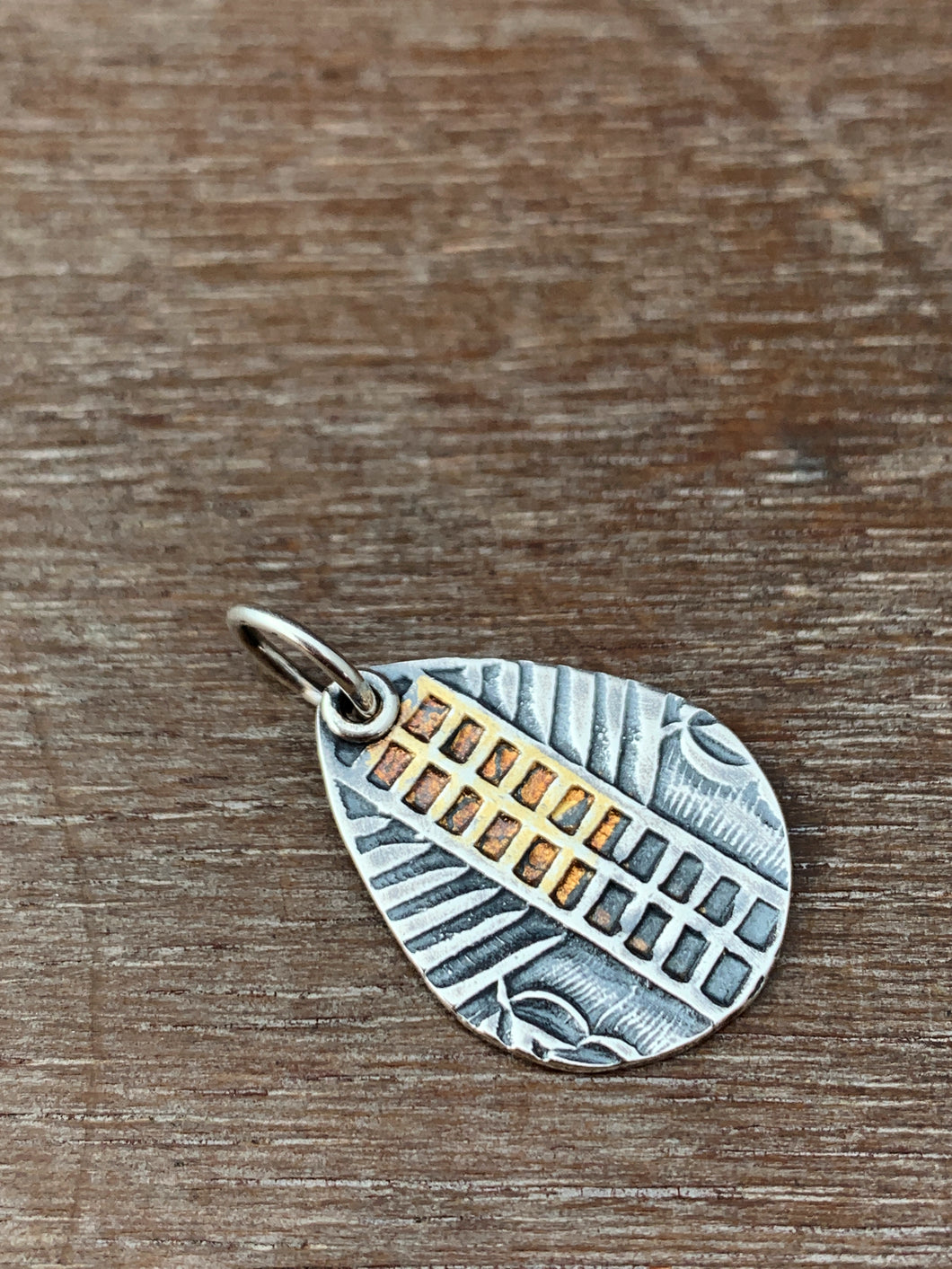 Silver and gold ladder pattern charm