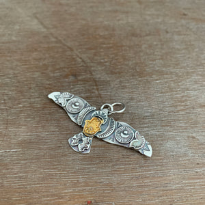 Large golden hamsa stamped bird pendant