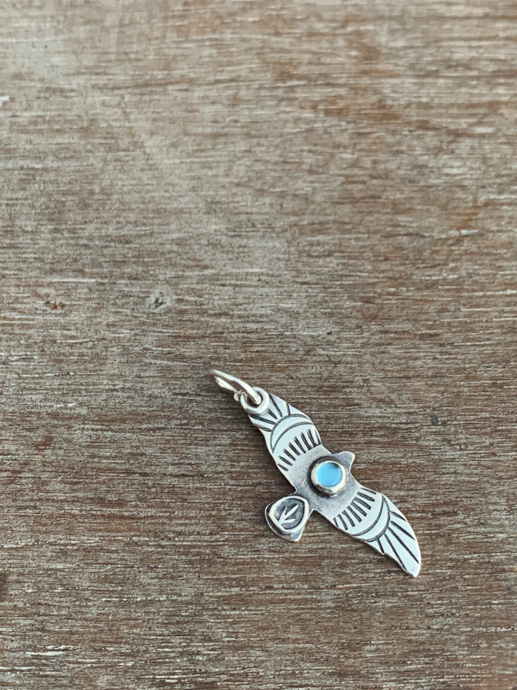 Small topaz stamped bird pendant