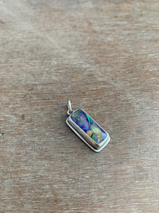 Synthetic opal charm