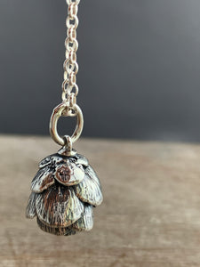 Cast cedar cone charm