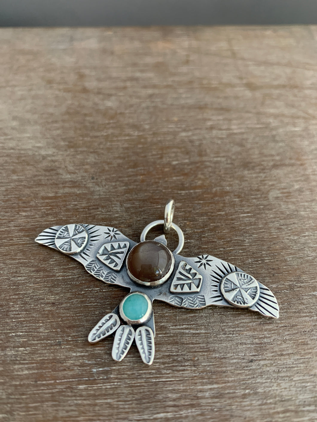 Large chocolate moonstone stamped bird pendant