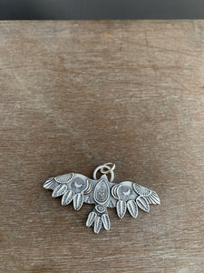 Large stamped bird pendant