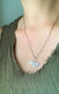 Small stamped bird pendant