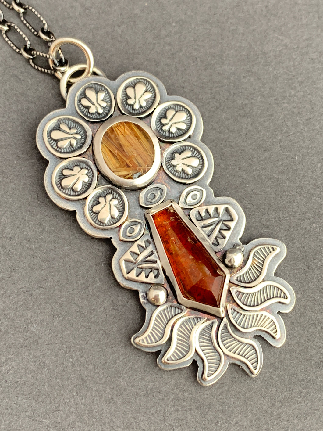 Rutilated quartz and orange kyanite pendant
