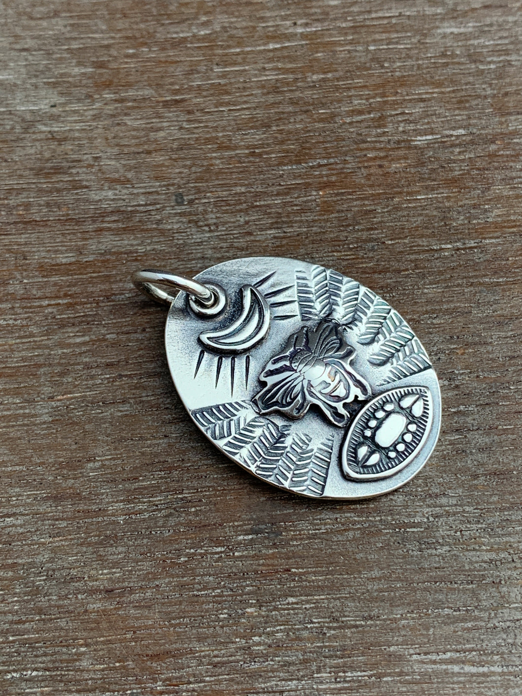 Sterling silver bee and eye pendant