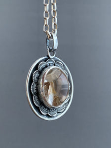 Included quartz double sided medallion